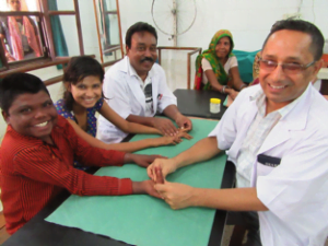 Vibya and Punwashi having daily hand physiotherapy