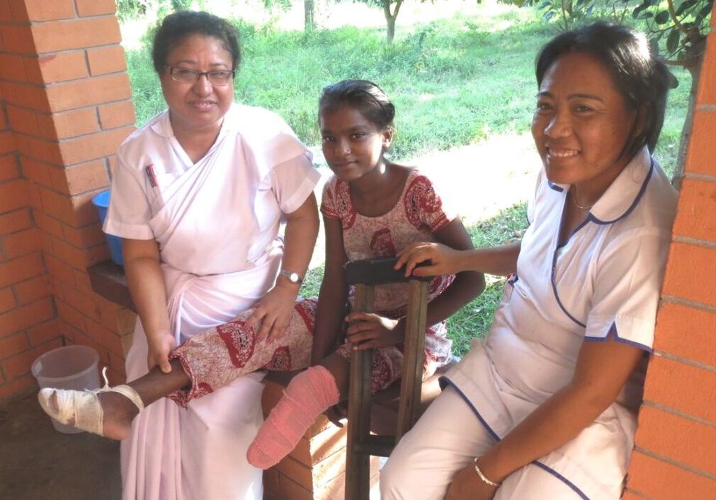 Nepal-Leprosy-Trust-Neelam-LLHSC Girl affected by leprosy with nurses at Lalgadh Leprosy Hospital & Services Centre, Nepal